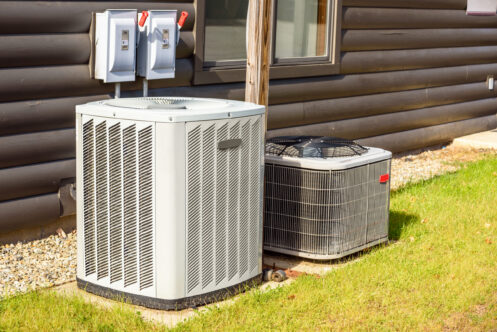 Air conditioner and heat pump outside a San Antonio home