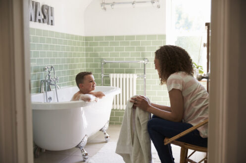 Mother And Son Having Fun At Bath Time Together