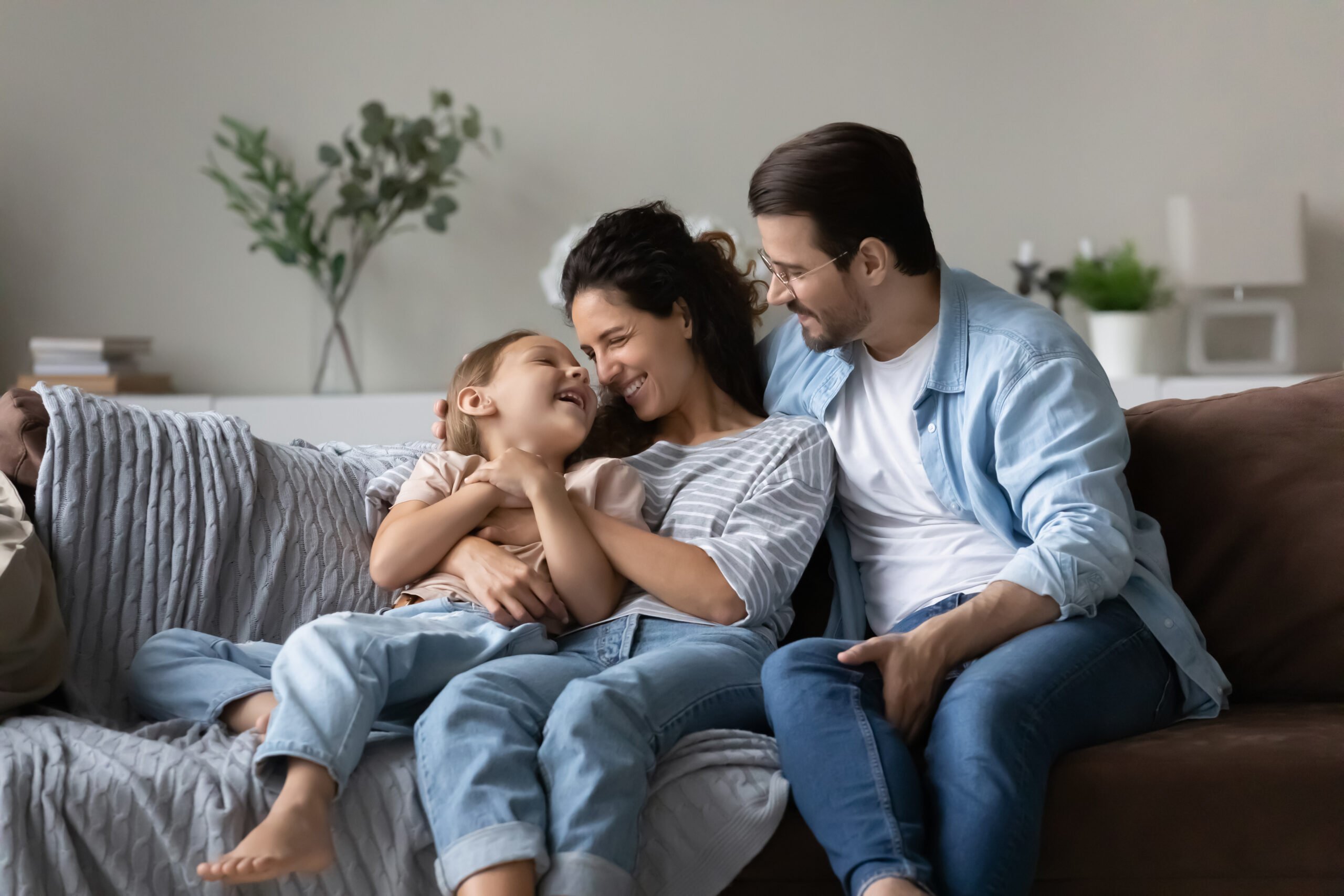 Family relaxing on couch