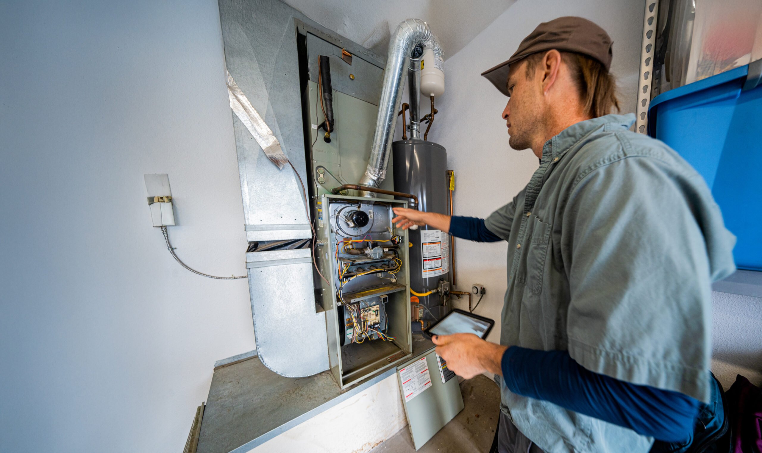 HVAC technician inspecting furnace